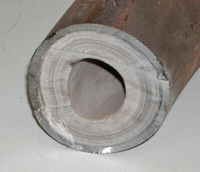 Inside of a water pipe narrowed by limescale buildup